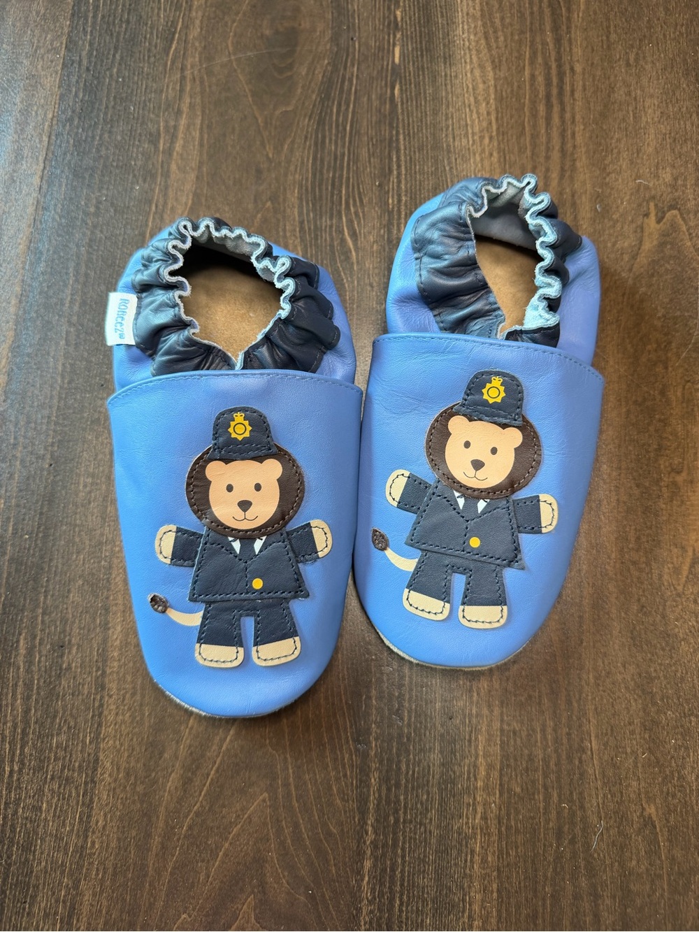 Robeez Blue Leather Baby Slip-Ons with Lion Officer Applique
